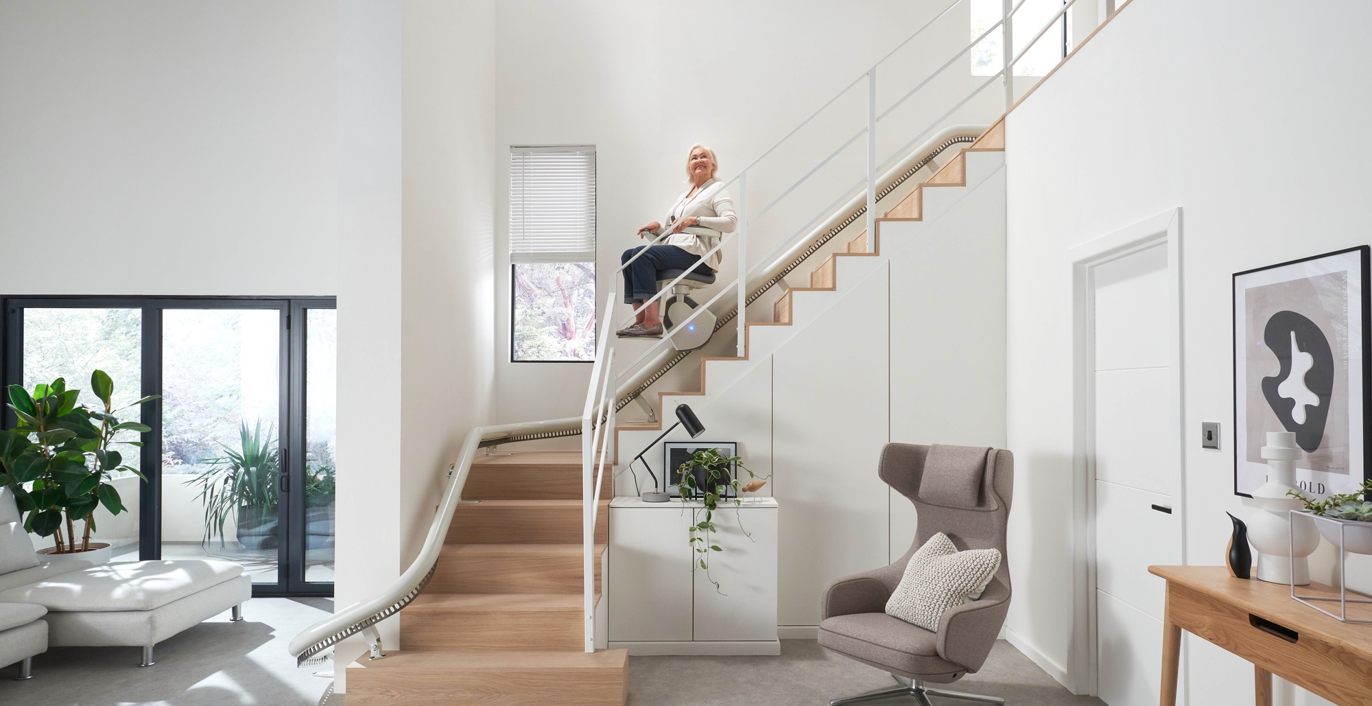 woman using curved stair lift