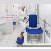 lady with aquatec bath lift