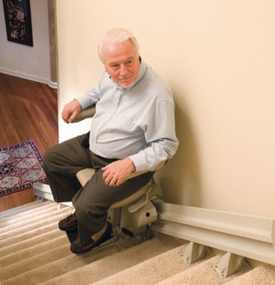 man using stair lift