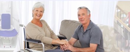 Couple with wheelchair at home