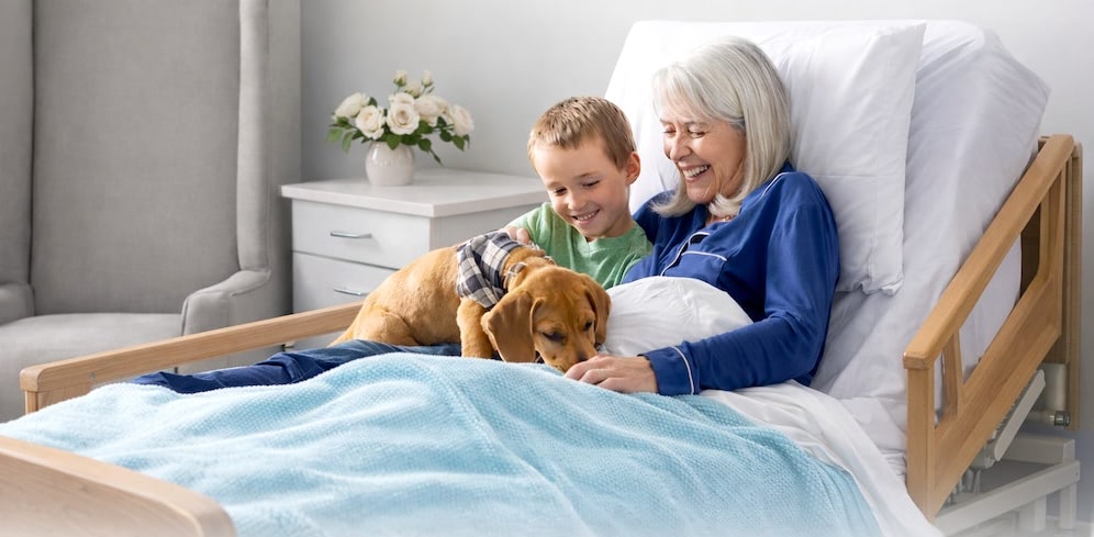 garndma with dog and grandson on bed