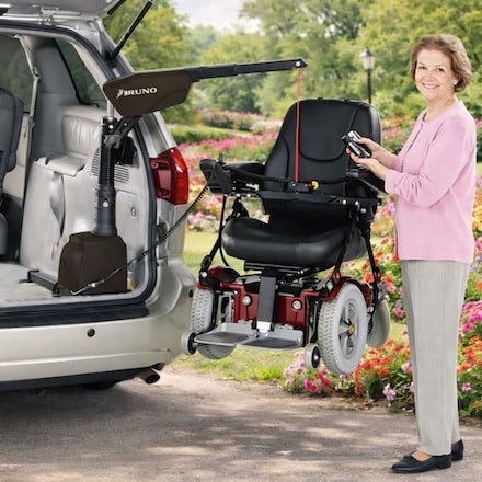 Lady using bruno lift with her powered wheelchair