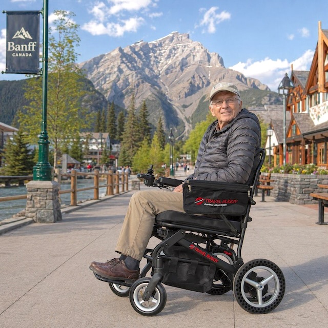 Man in Banff on travel buggy Power Wheelchair