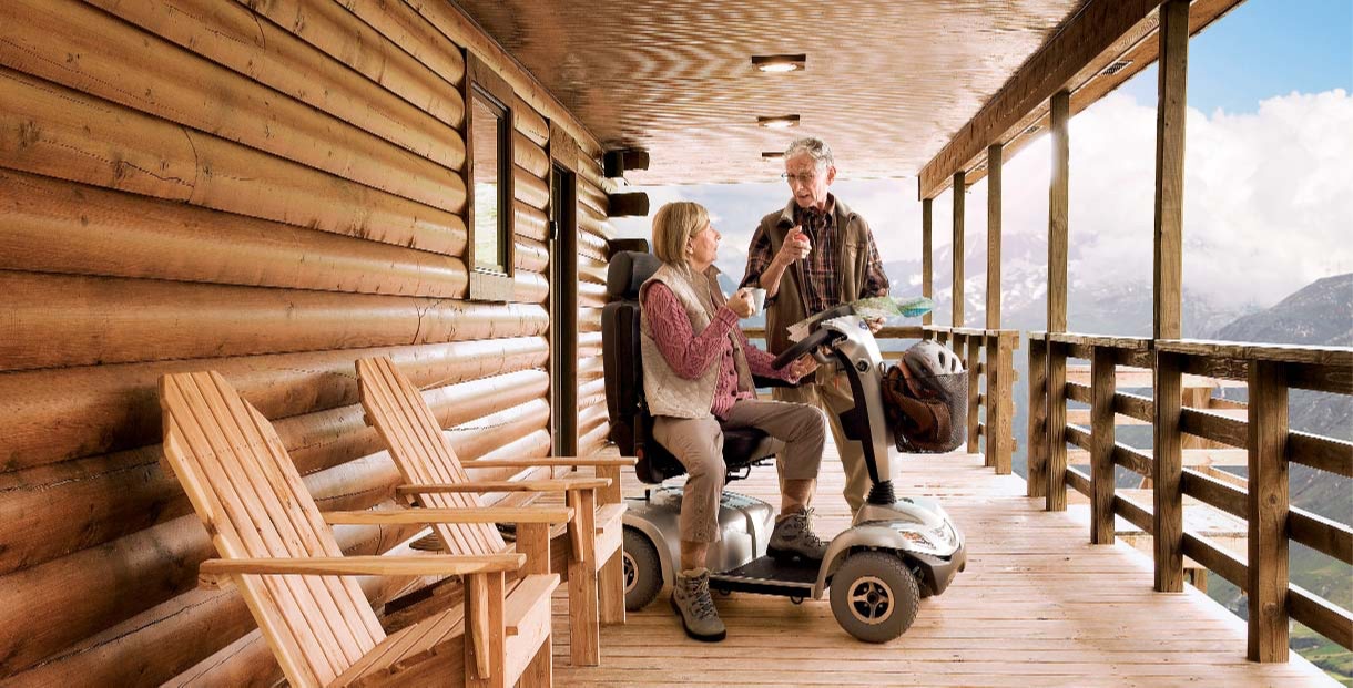 scooter at mountain cabin with couple