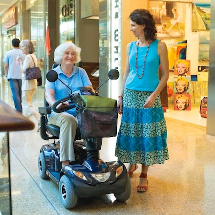 Mobility Scooter in mall with two ladies