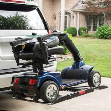 mobility scooter on platform outside back of vehicle